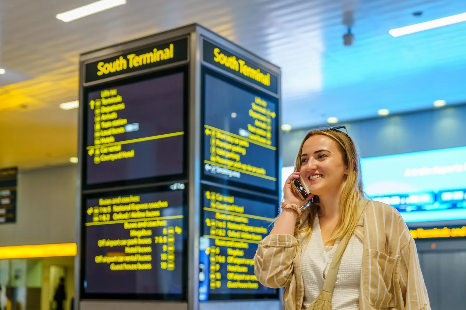 Entrepreneur making a call on his phone at the airport